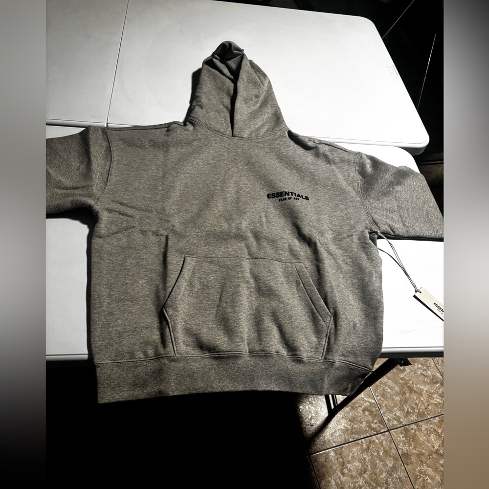 Essential M men’s hoodie color “dark oatmeal” 
Never worn with tags